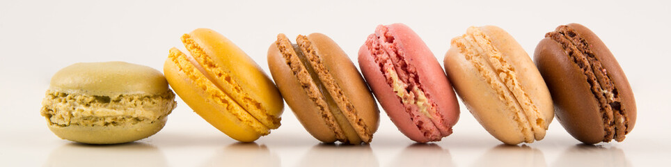 Macarons, Colorful Horizontal Stack of Macarons, isolated on white background with reflections, copy space, multiple colors, many