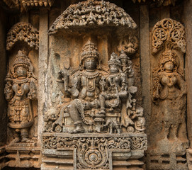 Artistic stone sculptures of Hindu Gods and Goddesses at Somanathapura Temple, Karnataka, India