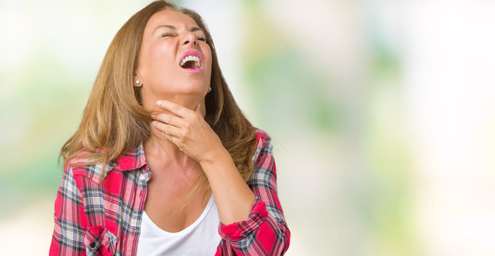 Beautiful middle age woman wearing over isolated background Touching painful neck, sore throat for flu, clod and infection