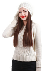 Smiling teenage girl wearing winter hat and gloves. Isolated
