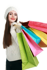 Happy girl shopping christmas gifts in shopping mall. Christmas shopping idea concept.