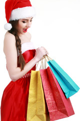 Happy girl shopping christmas gifts in shopping mall. Christmas shopping idea concept.