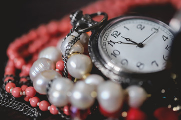 Old pocket watch and chain. Vintage. Jewelry. Time. Beads