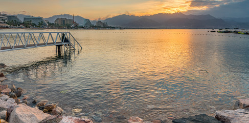 Morning panoramic view on the central public beach of Eilat - famous tourist resort and recreational city in Israel