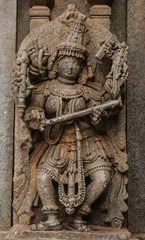 Fototapeta na wymiar Artistic stone sculptures and Carvings of Hindu Goddesses and Goda at Somanathapura temple in Karnataka, India