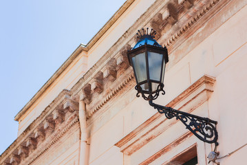 Old street lamppost – vintage light on historical building in Catania, Sicily, Italy