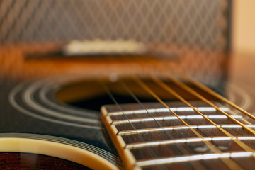 Classic vintage acoustic guitar with visible frats and wires. Close-up view