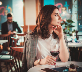 Beautiful woman sitting at the restaurant