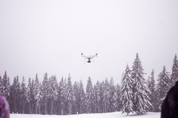 Flying drone in the forest. Flying Camcorder. Observation