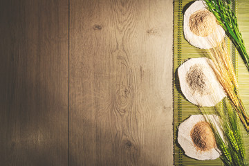 Rustic cooking background with different flours on the right side. Top view