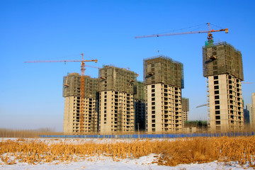 Unfinished buildings and tower crane