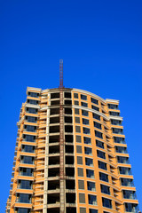 Fototapeta premium Unfinished buildings in the blue sky