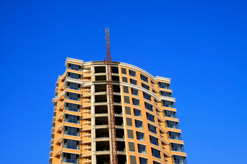 Fototapeta premium Unfinished buildings in the blue sky