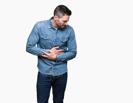 Young handsome man over isolated background with hand on stomach because nausea, painful disease feeling unwell. Ache concept.