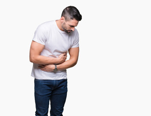 Fototapeta premium Young man wearing casual white t-shirt over isolated background with hand on stomach because nausea, painful disease feeling unwell. Ache concept.