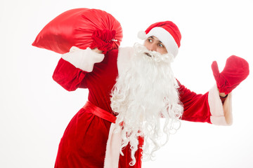 Santa claus holding a gifts against white background