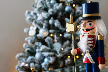 Nutcracker with Christmas scene in background