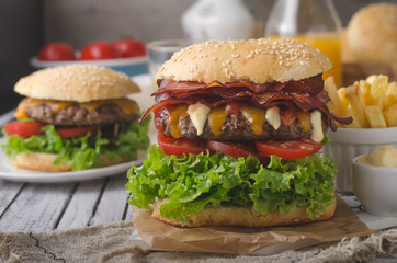 Homemade bacon burger with lettuce and cheddar