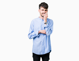 Young handsome business man over isolated background looking stressed and nervous with hands on mouth biting nails. Anxiety problem.