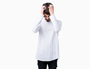 Young handsome man wearing sunglasses over isolated background suffering from headache desperate and stressed because pain and migraine. Hands on head.