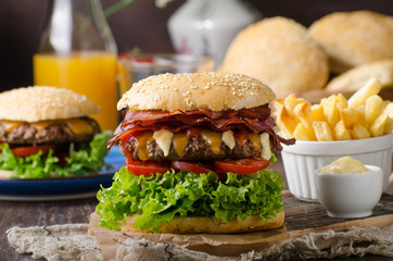Homemade bacon burger with lettuce and cheddar