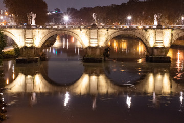 Fototapeta premium Night Image of Bridge Named Ponte Sant'Angelo In Rome Italy Across Tiber River Near Castle Saint Angelo.