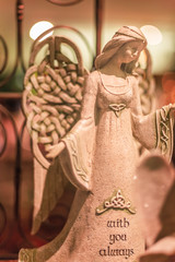 Clay Angel with arms open displayed for the holidays