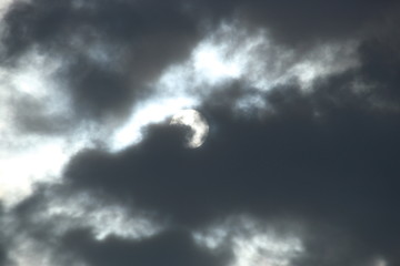 Fototapeta premium Black storm clouds cover the sun