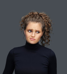 Portrait of confused young woman 