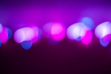purple background with blurred multicolored bokeh