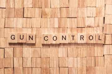 gun control spelled out in wooden letters