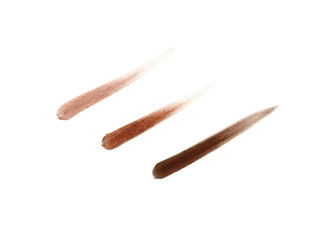 Set of matte eyeshadows in natural colors, brush or sponge strokes, smudged eye shadows or blushes. Isolated on white background.
