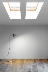 metal floor lamp in empty room with shadow on white wall and two dormer. Copy space for text