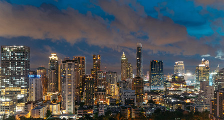 Cityscape Bangkok skyline at night, Thailand. Bangkok is metropolis and favorite of tourists live at between modern building / skyscraper.