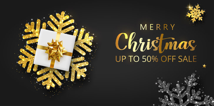 Merry Christmas sale promo banner with white gift box and shiny snowflakes.