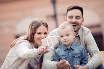 Happy family taking selfie together