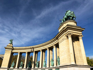 Man riding a chariot & holding a snake, represents War at the Millennium Monument, Heroes Square, Budapest, Hungary. It was sculpted by Zala György and completed in the late 1800s. 