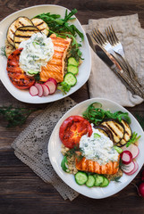 Grilled salmon, eggplants and tomatoes with quinoa and tzatziki sauce