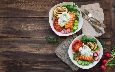 Grilled salmon, eggplants and tomatoes with quinoa and tzatziki sauce
