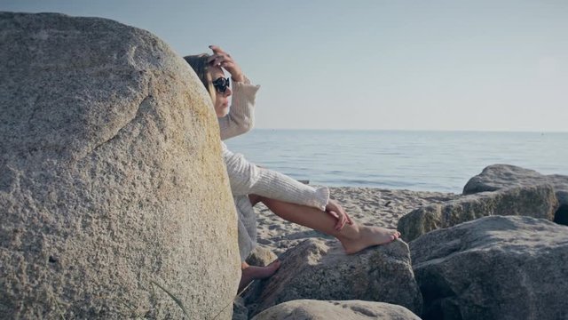 A creep gets caught spying on and filming a beautiful woman at the beach