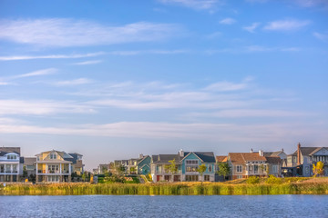 Idyllic view of Oquirrh Lake with homes and sky
