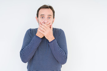 Handsome senior man over isolated background shocked covering mouth with hands for mistake. Secret concept.