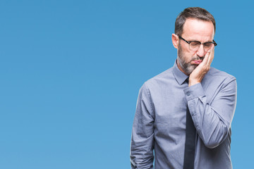 Middle age hoary senior business man wearing glasses over isolated background smiling in love showing heart symbol and shape with hands. Romantic concept.