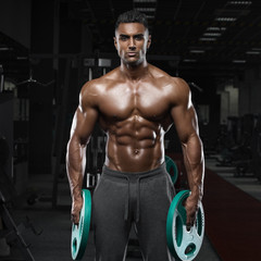 Muscular man working out in gym, strong arab male, naked torso abs