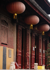 Entrance to the main hall decorated with lanterns in a buddhist temple in the old town of Suzhou, China, Asia