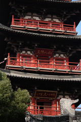 Chinese pagoda as part of a temple complex with red balcony in Suzhou, China