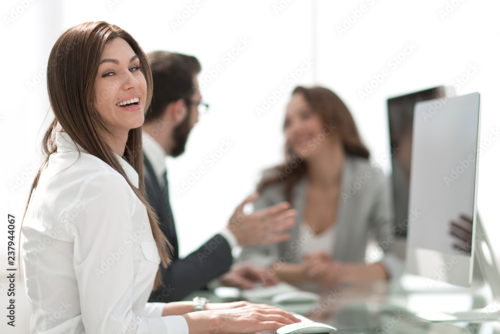 Sticker side view.smiling business woman sitting at the Desk