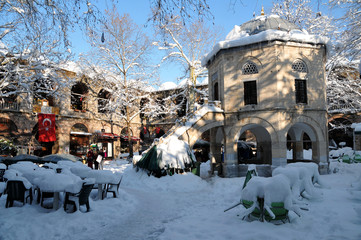 historic kozahan bazaar covered with snow © recepelal