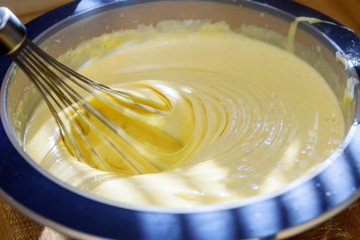 Cooking buttery cream on kitchen