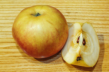 Fresh, natural apples. Whole and cut apple. Coriander, delicious product